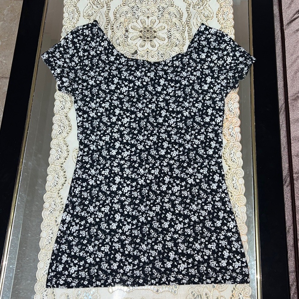 Garage black short sleeved t-shirt with white floral print and back cutouts